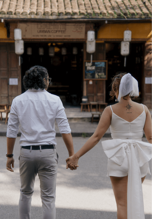 Matt & Ella in crossing the road holding hands