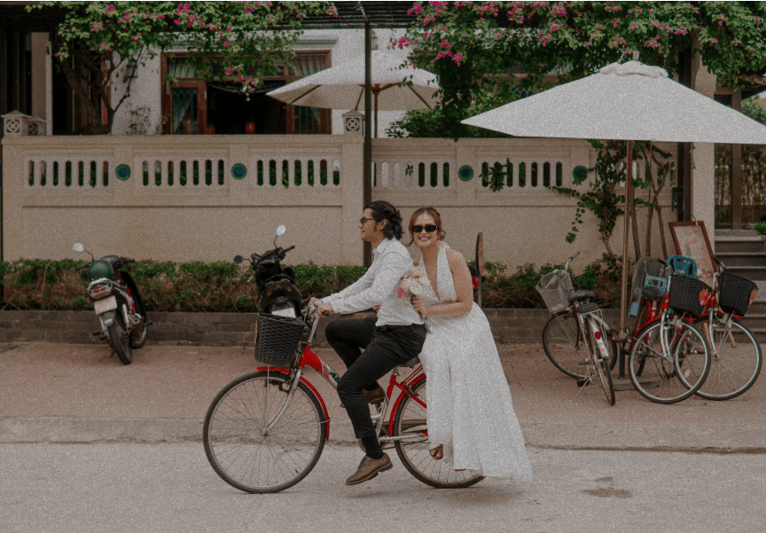 Matt and Ella riding a bicycle